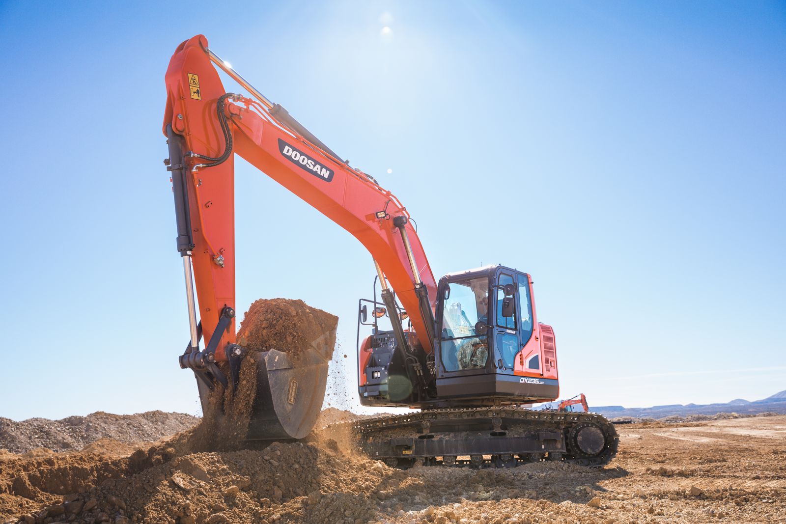 Excavator carrying out earthmoving